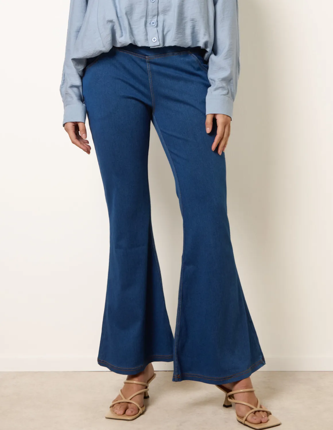 Flared Cross Over Waistband Jeans
